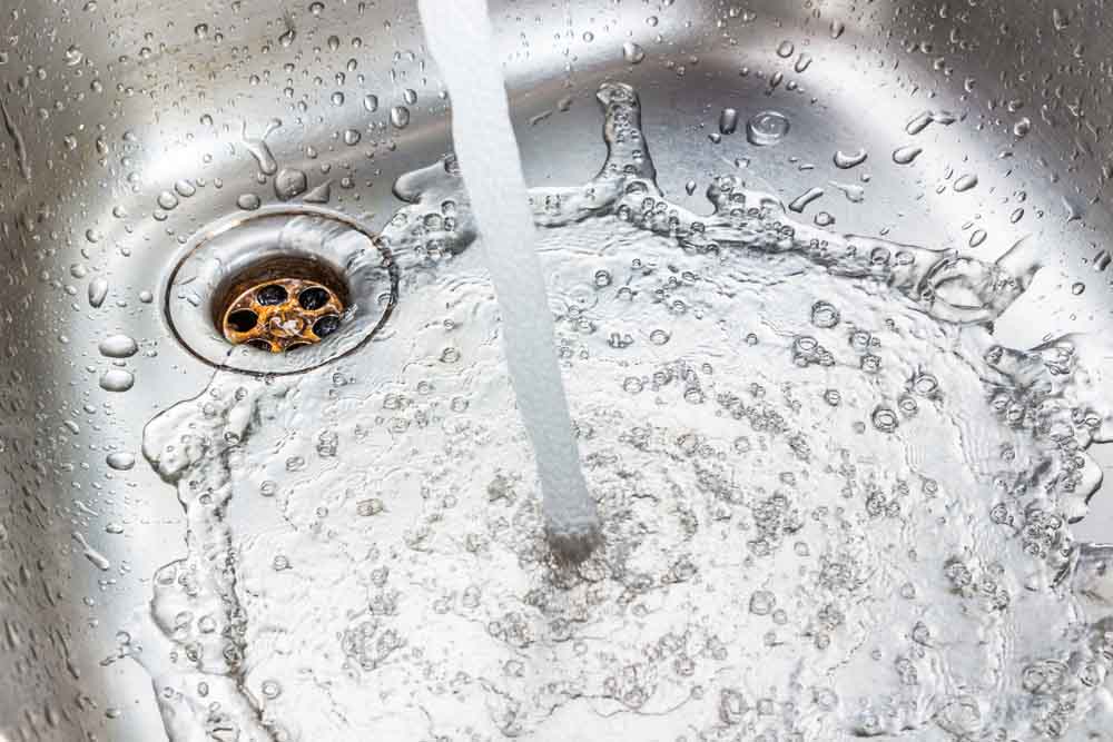 water flowing down the drain