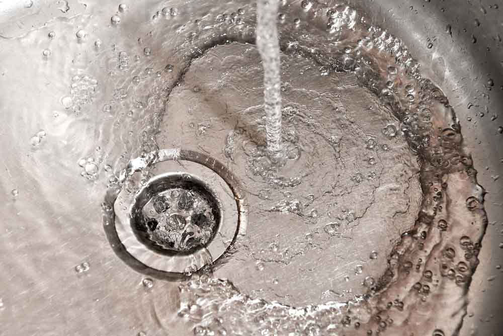 water flowing down the drain